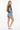 3/4 Back - Mixed-race model, denim shorts