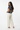 3/4 Back - South Asian model, cream linen pants