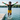 6-8 year old Black boy jumping off dock in Play Robo rash guard