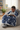 Black boy reading with blanket on bean bag