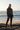 Black model — black joggers, beach rocks golden hour
