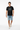 Black tee walking pose