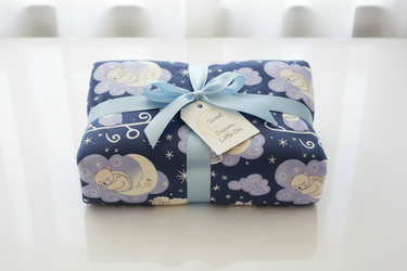 Blanket wrapped as baby shower gift