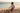 Boy building sandcastle
