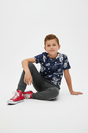 Boy in tee with track pants