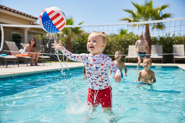 Boy playing water volleyball