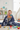 Boy playing with toys wrapped in blanket