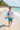 Boy Running with Surfboard