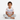 Boy sitting in Never Ending Adventures tee on white background