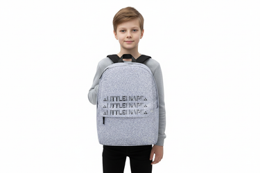 Boy standing with backpack