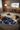 Boy watching TV under blanket