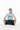 Buzz cut model sitting cross-legged