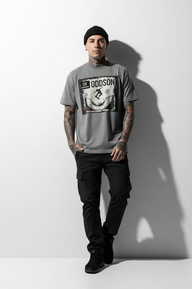 Charcoal tee with tattoos leaning