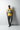 Cornsilk yellow tee with charcoal sweatpants and slip-ons