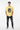 Cornsilk yellow tee with hands in pockets