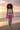 Curly mixed-race model — crop tank, sunset shoreline