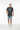 Dark heather grey tee mid-step walking