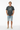 Dark heather grey tee with hands in pockets