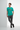 Deep teal t-shirt with charcoal sweatpants and slip-ons