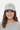 Female model close-up wearing silver trucker hat