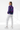 Female model three-quarter back with white pants