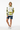 Female model with board shorts confident standing