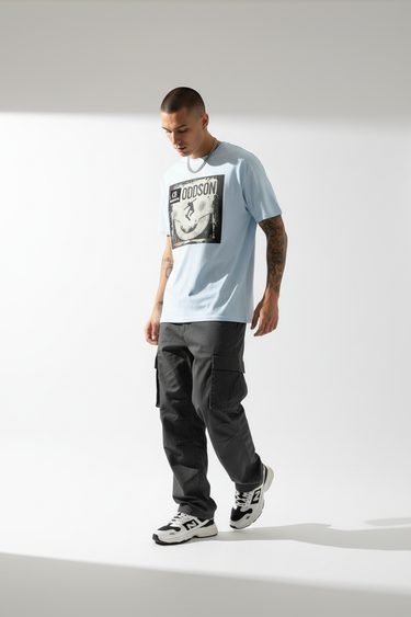 Grey tee mid-step walking