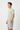 Grid Pulse Tee with grey board shorts side
