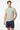 Grid Pulse Tee with navy board shorts angle