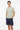 Grid Pulse Tee with navy board shorts confident pose