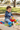 Boy wearing LITTLEcHAPS Space Explorer hoodie playing in sandbox