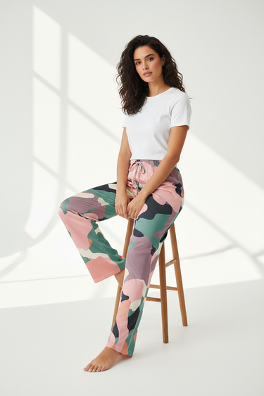 Woman sitting in camo-print pajama pants