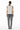 Back view of vest with grey wool trousers in professional setting