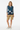 Tropical palm vest over striped tee for preppy summer look
