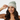 Latina female model wearing Greys beanie - adjusting fit