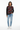 Geometric hearts sweater styled casually with light wash denim and white sneakers