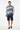 Tropical palm sweater with navy shorts for summer coastal style
