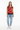 Bold hearts red vest styled casually with light wash denim and white sneakers