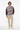 Distressed texture sweater with beige corduroy pants for relaxed casual style