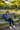 Girl wearing LITTLEcHAPS Space Explorer hoodie reading on bench