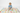 Child playing with blocks on alphabet blanket white background