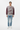 Distressed texture sweater styled casually with light wash denim and white sneakers