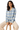 Woman sitting in plaid pajama top