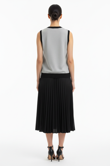 Back view of vest with pleated midi skirt