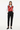 Bold hearts vest layered over white shirt for smart-casual look