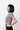 Model 4 - Side view of rainbow palm crop tee