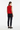 Back view of bold hearts vest with dark trousers