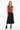 Bold hearts vest with black midi skirt for feminine chic style