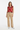 Bold hearts vest with beige corduroy pants for relaxed casual style