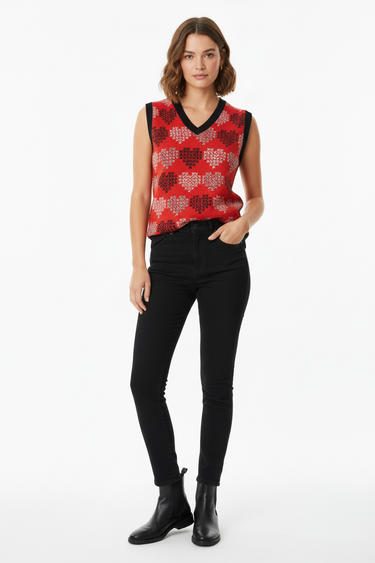 Bold hearts vest with black jeans for modern casual aesthetic
